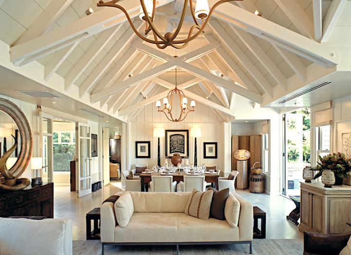 Luxury interior of white wooden building with vaulted roof and sofas